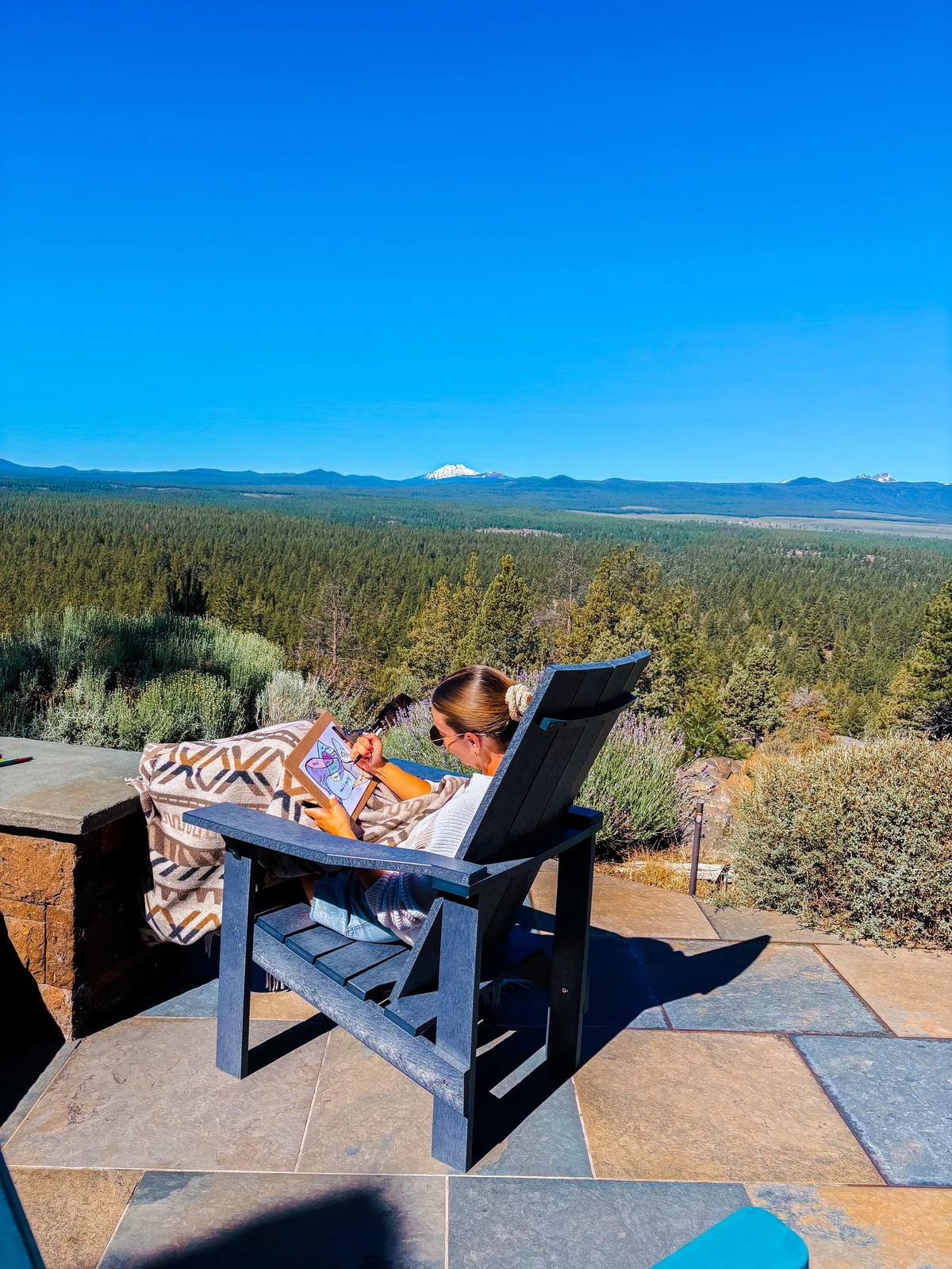 Journaling on the patio, the Cascades ahead.